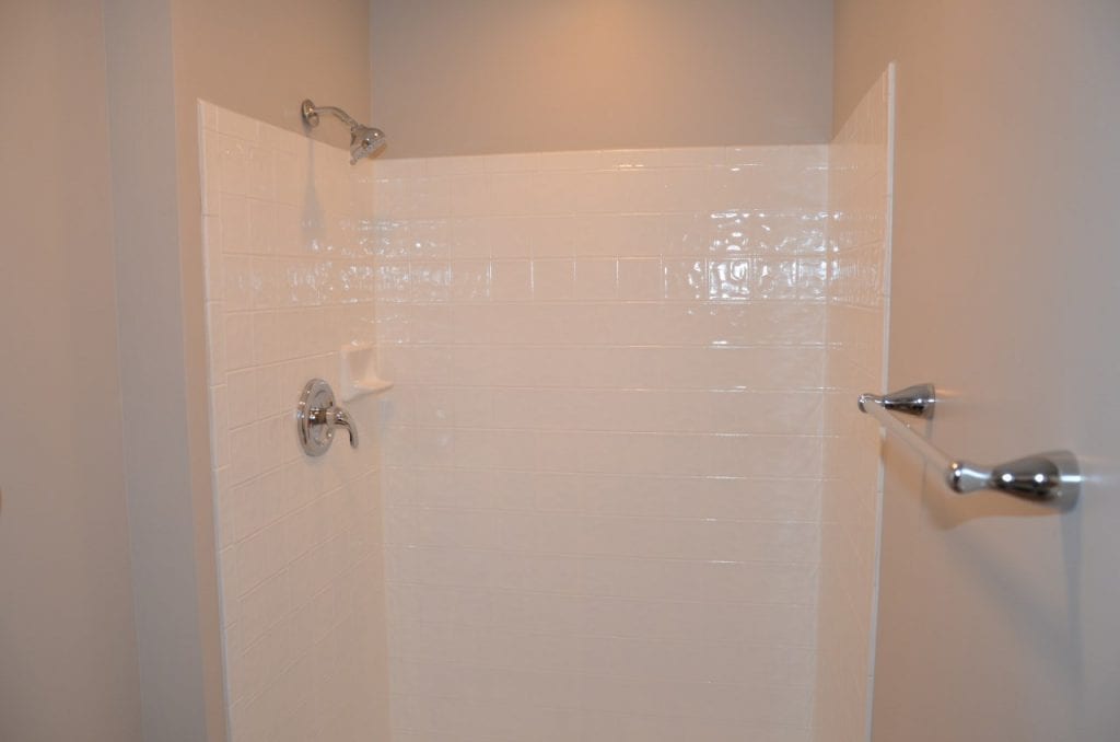 After: a new shower with modern fixtures and better lighting