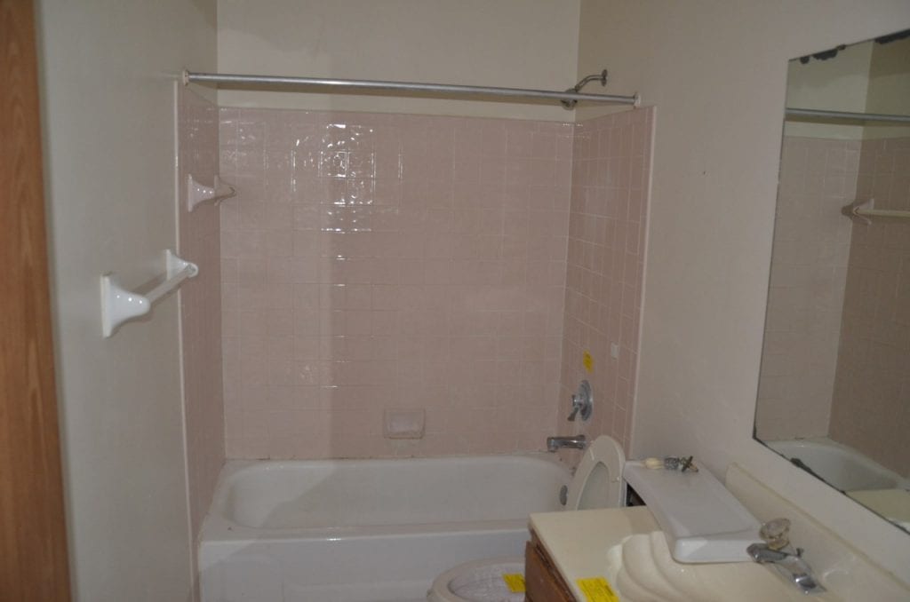Before: a very outdated bathroom with old fixtures