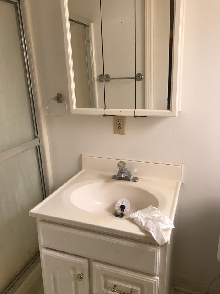 Before: an outdated bathroom with old fixtures