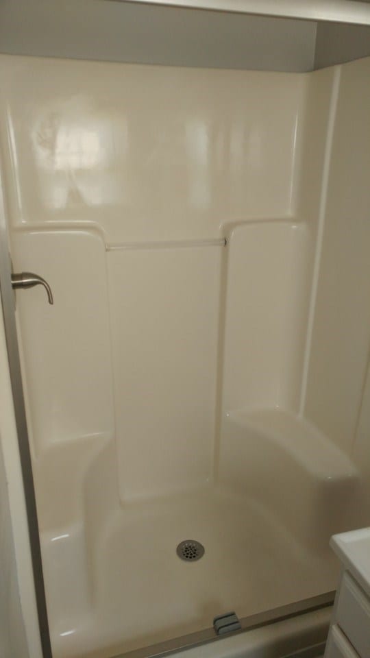 After: a well-lit shower area
