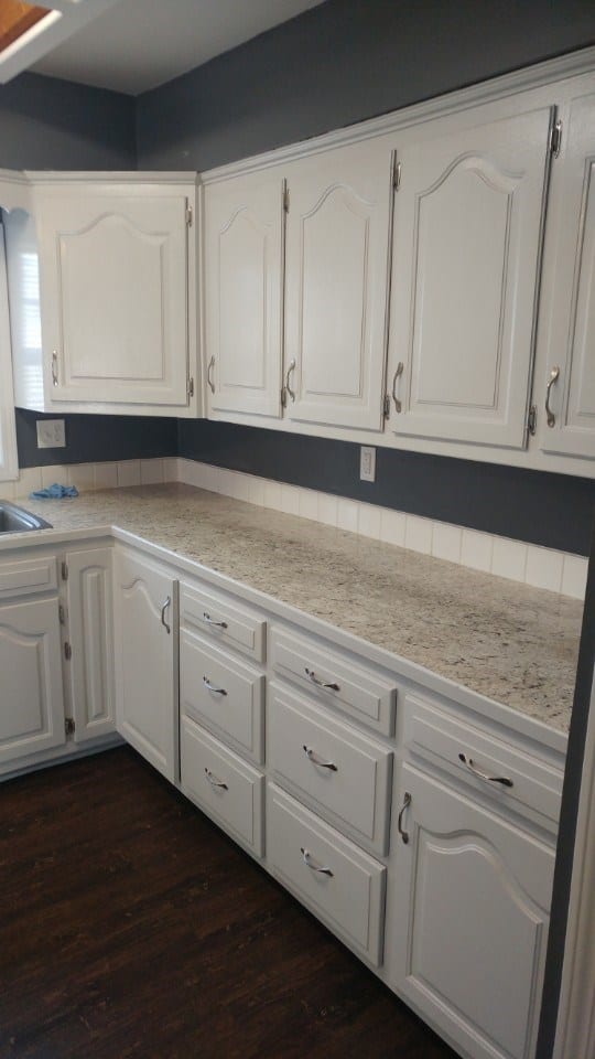 After: a modern kitchen with new tile and fresh paint